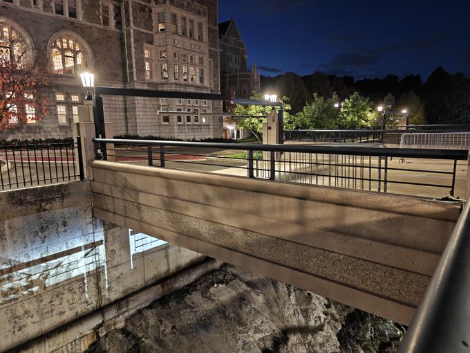 a small bridge into a parking lot